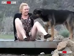 Mad and horny MILF gets licked by her dog in outdoor 